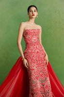 Le Thanh Hoa Imperial Peony gown featuring elegant floral embroidery and flowing fabric, perfect for formal occasions.
