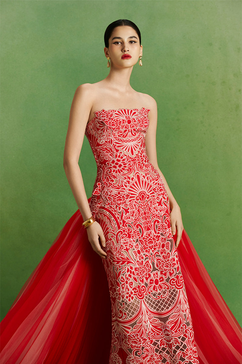 Le Thanh Hoa Imperial Peony gown featuring elegant floral embroidery and flowing fabric, perfect for formal occasions.