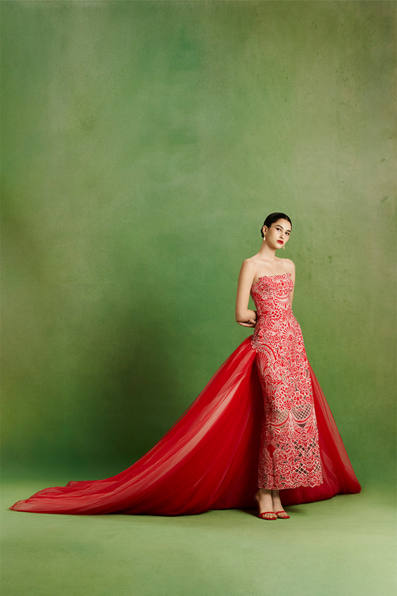 Elegant Imperial Peony gown by Le Thanh Hoa featuring intricate floral embroidery and flowing fabric.