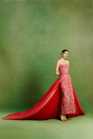 Le Thanh Hoa Imperial Peony gown featuring intricate floral embroidery and elegant flowing fabric.