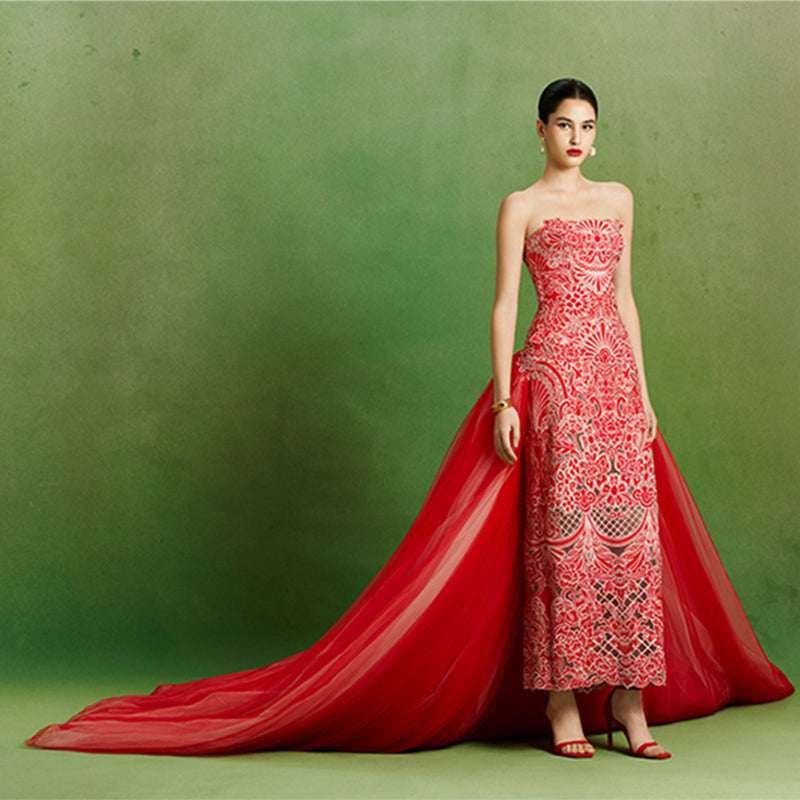 Elegant Imperial Peony gown by Le Thanh Hoa featuring intricate floral embroidery and flowing fabric.