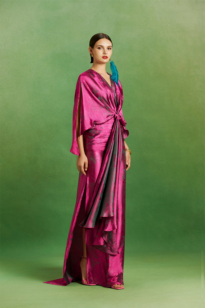 Le Thanh Hoa Ma Chau heritage maxi dress with intricate traditional embroidery and vibrant fabric, perfect for cultural occasions.