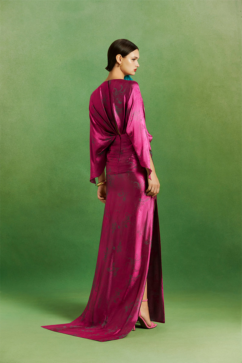 Le Thanh Hoa Ma Chau Heritage dress, elegant maxi dress with traditional embroidery and vibrant fabric design.