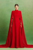 Elegant Scarlet Majesty gown by Le Thanh Hoa featuring rich fabric and intricate design, displayed on a mannequin.