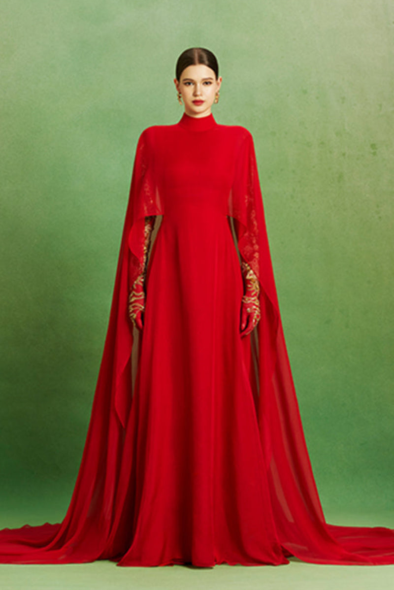 Elegant Scarlet Majesty gown by Le Thanh Hoa featuring rich fabric and intricate design, displayed on a mannequin.