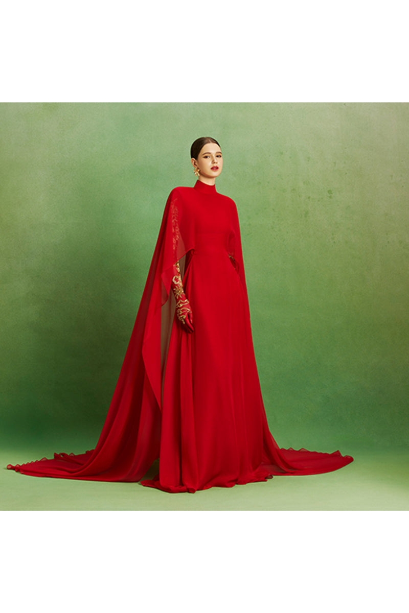 Elegant Scarlet Majesty gown by Le Thanh Hoa with intricate detailing, flowing fabric, and regal design, perfect for formal occasions.