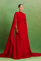 Le Thanh Hoa Scarlet Majesty Gown featuring elegant red fabric and intricate detailing, perfect for formal occasions.