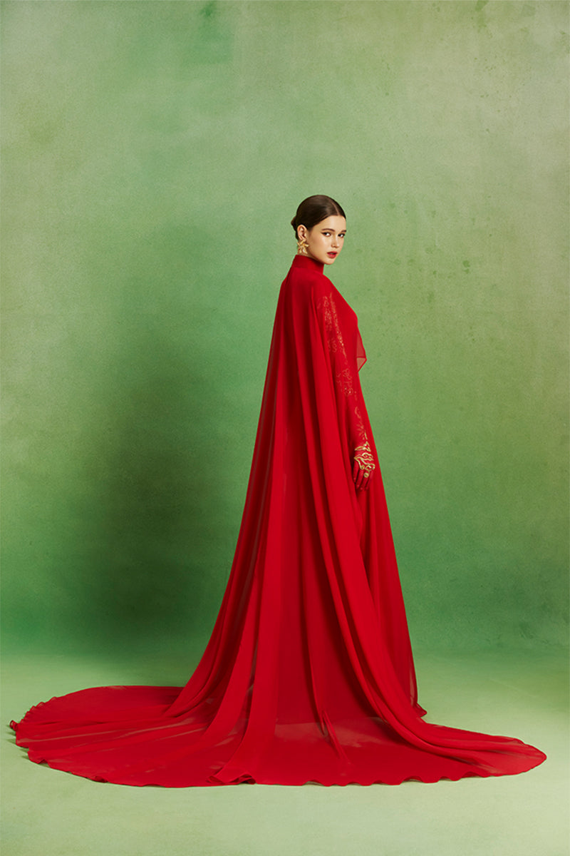 Elegant Scarlet Majesty Gown by Le Thanh Hoa featuring intricate design and flowing fabric, perfect for formal occasions.