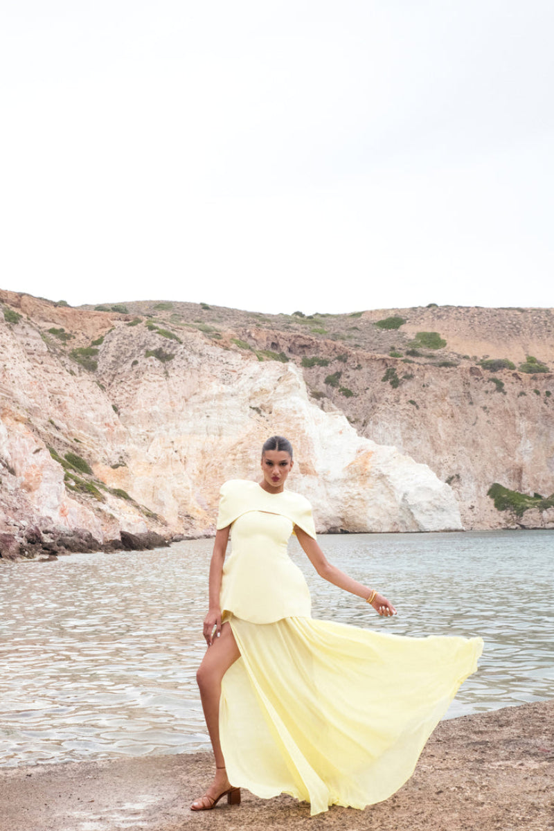 Matters Verona butter yellow gown with a flowing design, elegant neckline, perfect for formal occasions.