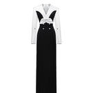 Elegant white and black Shalom gown by Jenny K Tran, showcasing a flowing design with intricate detailing and a sophisticated silhouette.