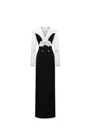 Elegant white and black Shalom gown by Jenny K Tran, showcasing a flowing design with intricate detailing and a sophisticated silhouette.