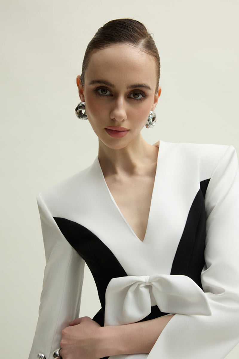 Elegant white and black Shalom gown by Jenny K Tran, featuring a flowing design and intricate details.