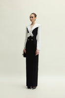 White and black Shalom gown by Jenny K Tran, elegant dress with flowing fabric and stylish design.