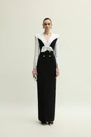 Jenny K Tran Shalom gown in white and black, elegant dress with a flowing design, displayed on a model.