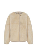 Reversible shearling jacket by TAGG, showcasing soft shearling fabric with a stylish design, suitable for cold weather.