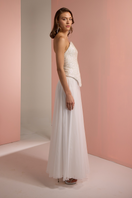 White Joanna Andraos corset top and palazzo trouser co-ord set shown from side view, featuring a fitted corset and flowing palazzo pants.