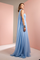 Baby blue strapless gown with matching scarf by Joanna Andraos, shown from the side, elegant and flowing design.