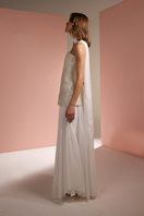 Joanna Andraos white strapless top and skirt co-ord set with matching scarf, shown from side view.
