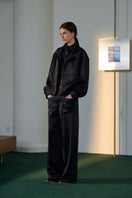 Black Sienna Pants by Lorena Saravia, shown in a large image, featuring tailored design and sleek fit.