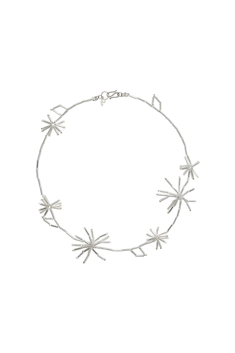 Silver dandelion necklace by Pura Utz featuring a delicate dandelion pendant on a sleek silver chain.