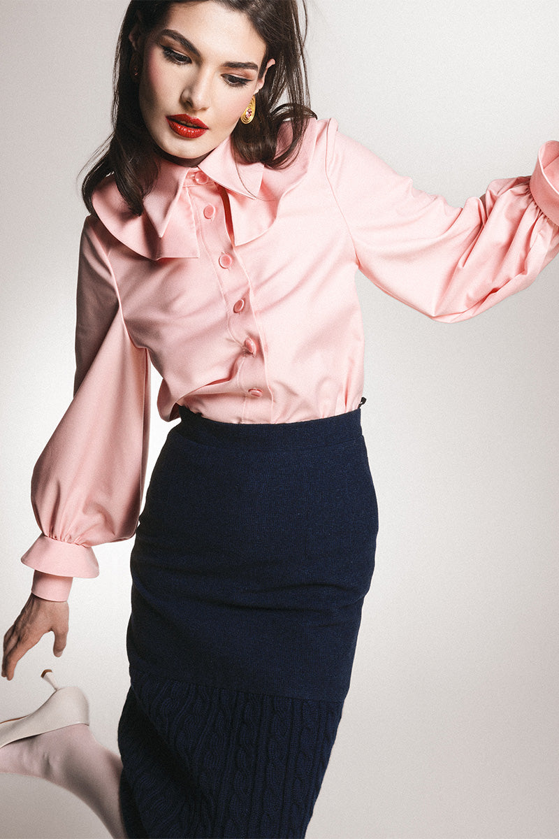 Navy knit midi skirt by Liya, featuring a classic length and soft knit fabric, styled for a versatile, elegant look