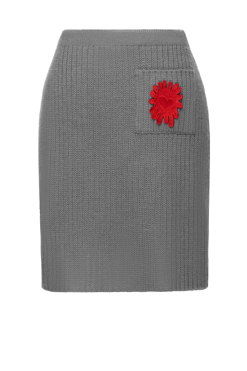 Liya grey mini skirt with a fitted design, shown on a model with a high waist and stylish hemline, perfect for casual or chic outfits.