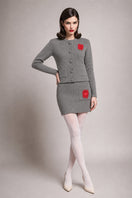 Liya grey mini skirt with a fitted design, shown on a model, perfect for casual or chic outfits.
