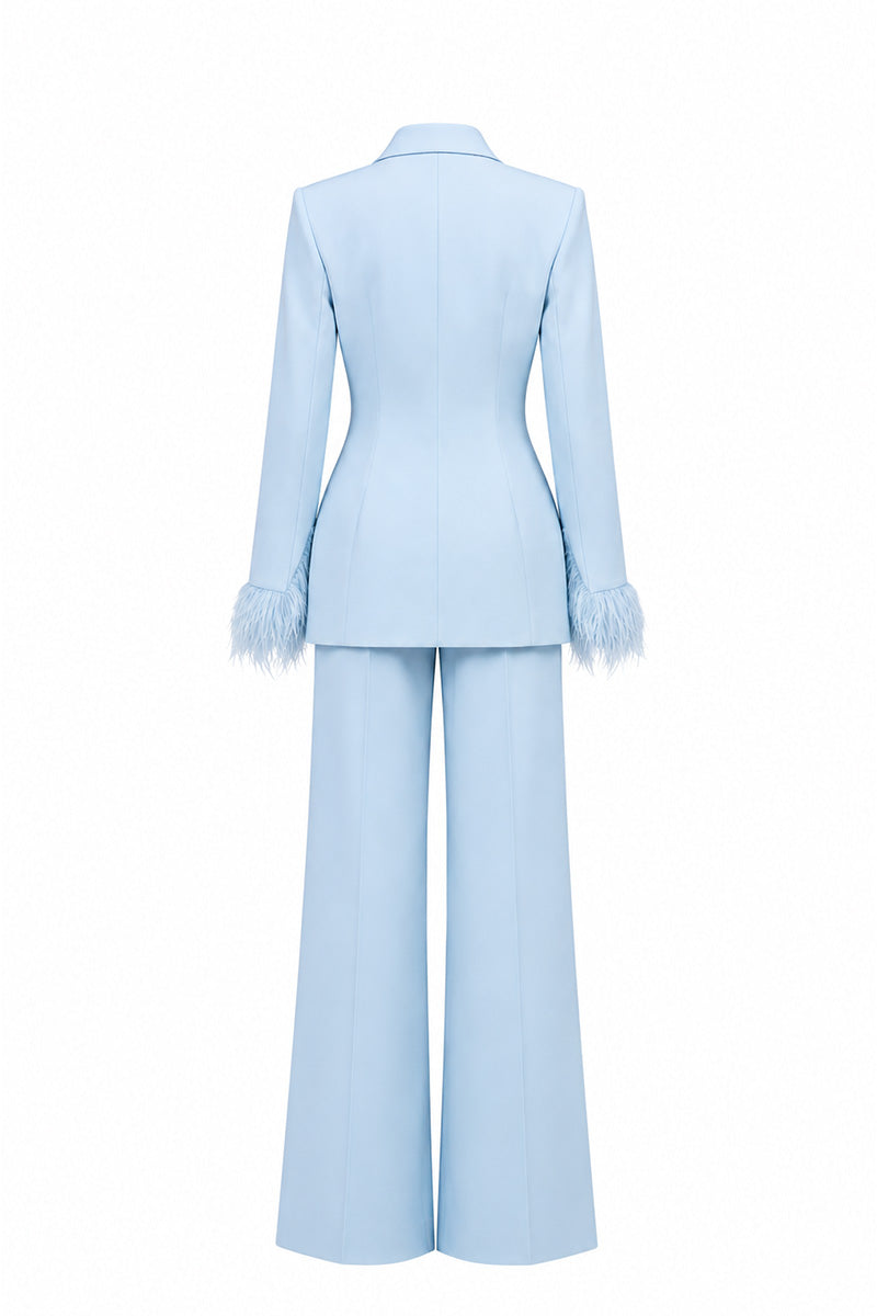 Baby blue hourglass suit set with feather details by Joanna Andraos, featuring a stylish and elegant design.