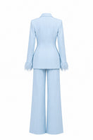 Baby blue hourglass suit set with feather details from Joanna Andraos, featuring a fitted design and elegant feather embellishments.