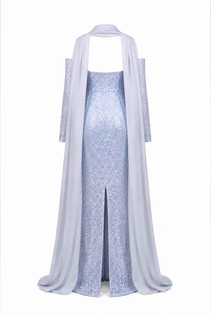 Baby blue to silver ombré embroidered gown by Joanna Andraos, featuring detailed embroidery and flowing fabric.