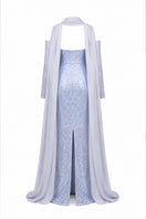Baby blue to silver ombré embroidered gown by Joanna Andraos, featuring delicate embroidery and flowing fabric.