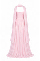 Elegant blush evening gown by Joanna Andraos with flowing fabric and delicate detailing, designed for formal occasions.