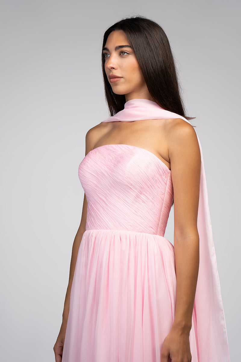 Elegant blush evening gown by Joanna Andraos featuring flowing fabric and intricate detailing, perfect for formal occasions.