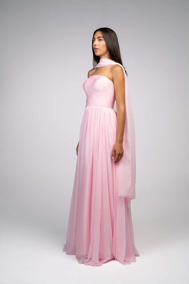 Elegant blush evening gown by Joanna Andraos, flowing fabric with intricate details perfect for formal events.