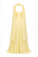 Yellow strapless gown by Joanna Andraos featuring a flowing design and elegant silhouette, perfect for formal occasions.