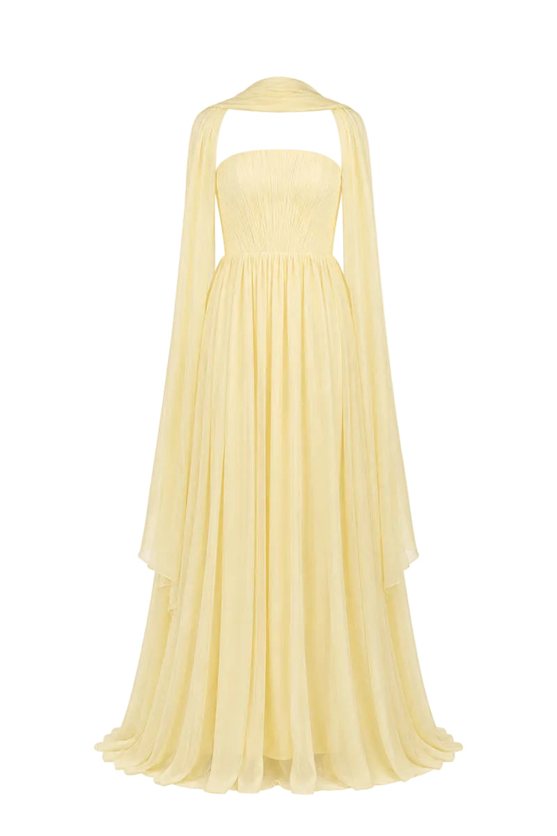 Yellow strapless gown by Joanna Andraos, featuring elegant design and flowing fabric, perfect for formal occasions.