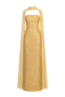 Gold embroidered Joanna Andraos gown with intricate embroidery and flowing fabric, showcasing elegant evening wear.