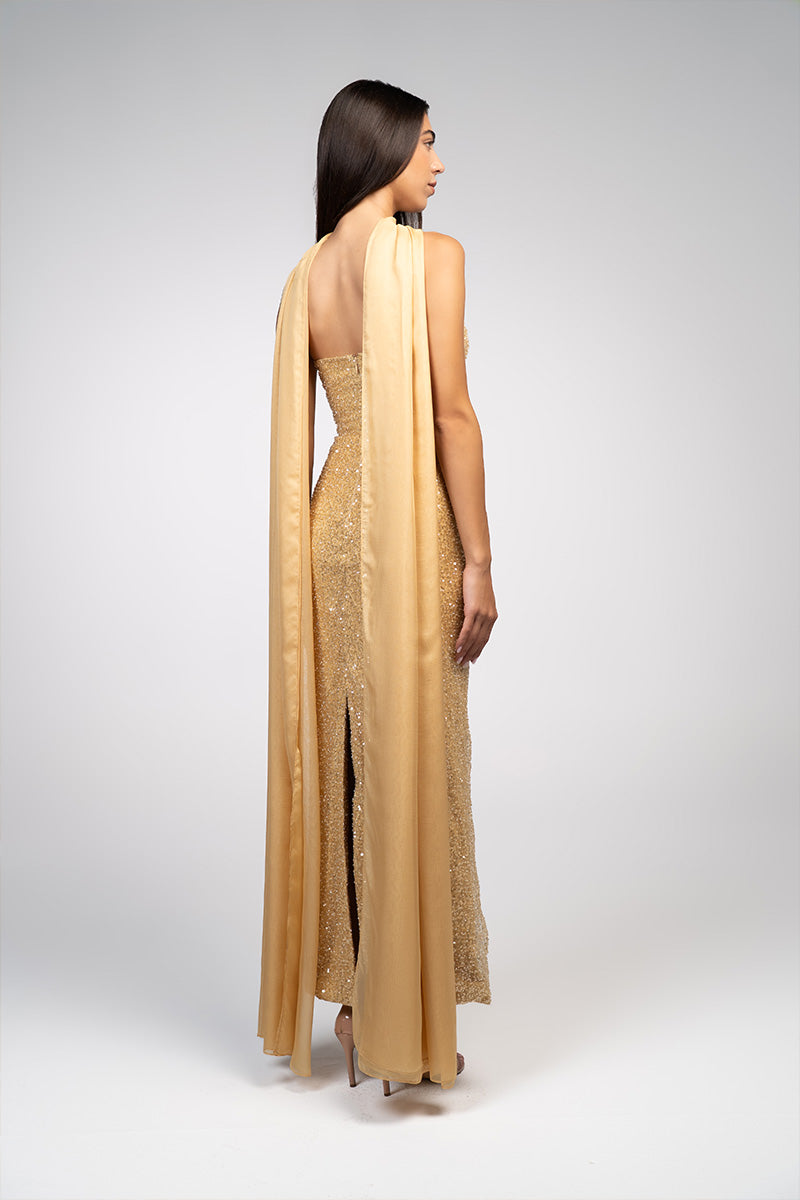 Gold embroidered gown by Joanna Andraos featuring intricate embroidery and elegant design, perfect for formal occasions.
