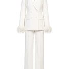 Ivory white hourglass suit set with feather details by Joanna Andraos, featuring a fitted silhouette and elegant design.
