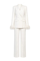 Ivory white hourglass suit set with feather details by Joanna Andraos, featuring a fitted silhouette and elegant design.