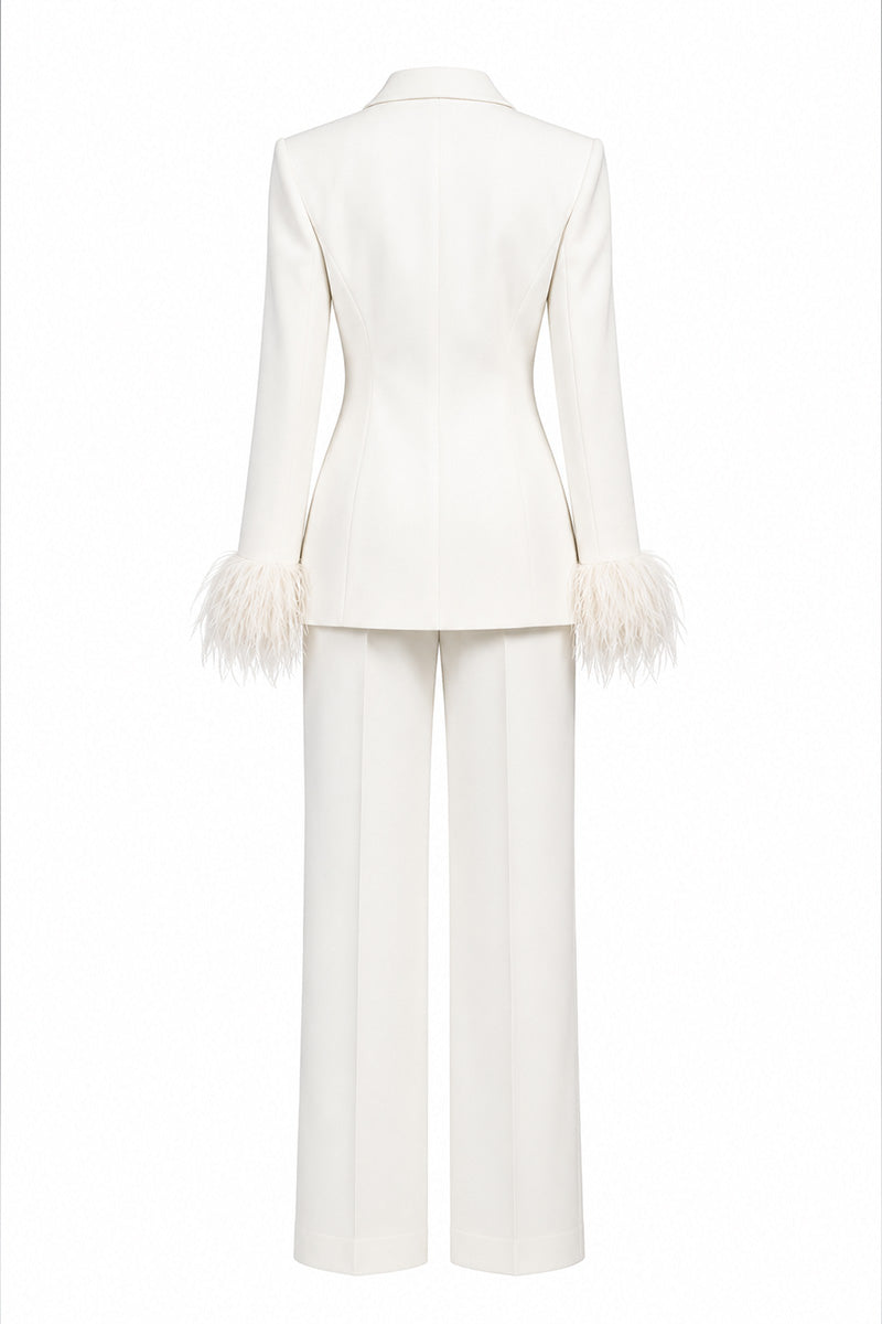 Ivory white hourglass suit set with feather details by Joanna Andraos, featuring a fitted silhouette and elegant style.