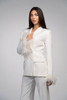 Ivory white hourglass suit set with feather details by Joanna Andraos, featuring a tailored fit and elegant design.