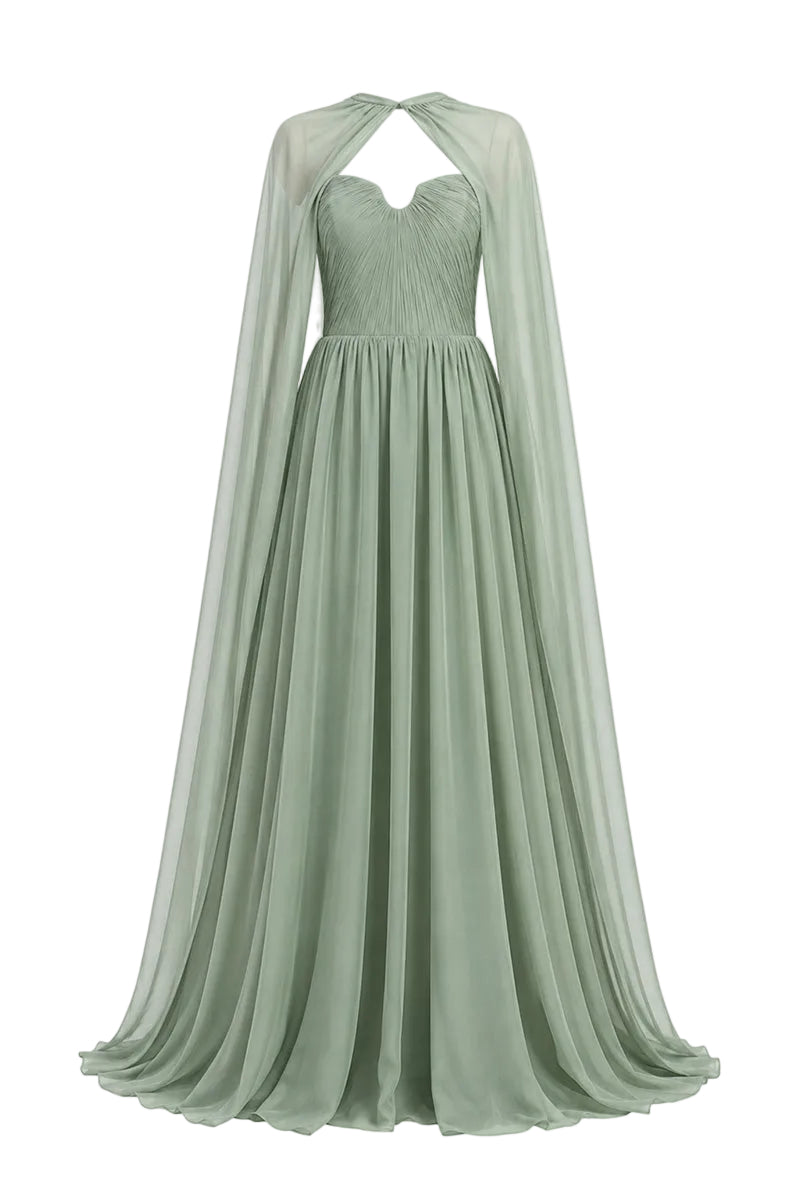 Elegant strapless gown by Joanna Andraos with a detachable cape, showcased on a model in a formal setting.