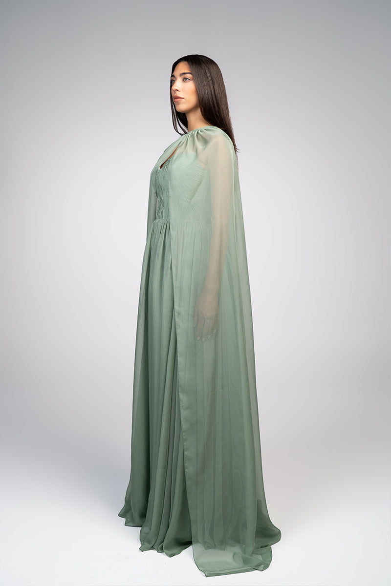 Joanna Andraos strapless gown with a flowing silhouette and a detachable cape, elegant formal evening wear.