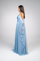 Baby blue strapless gown by Joanna Andraos, elegant floor-length dress with a fitted bodice and flowing skirt.