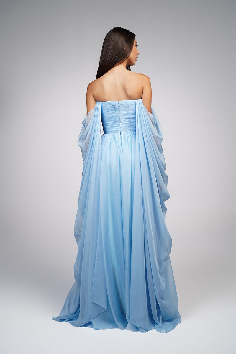 Baby blue strapless gown by Joanna Andraos, featuring elegant fabric and a flowing silhouette, perfect for formal occasions.
