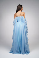 Baby blue strapless gown by Joanna Andraos featuring elegant fabric and a flowing silhouette.