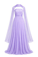 Elegant lavender gown by Joanna Andraos featuring flowing fabric and intricate detailing, perfect for formal occasions.