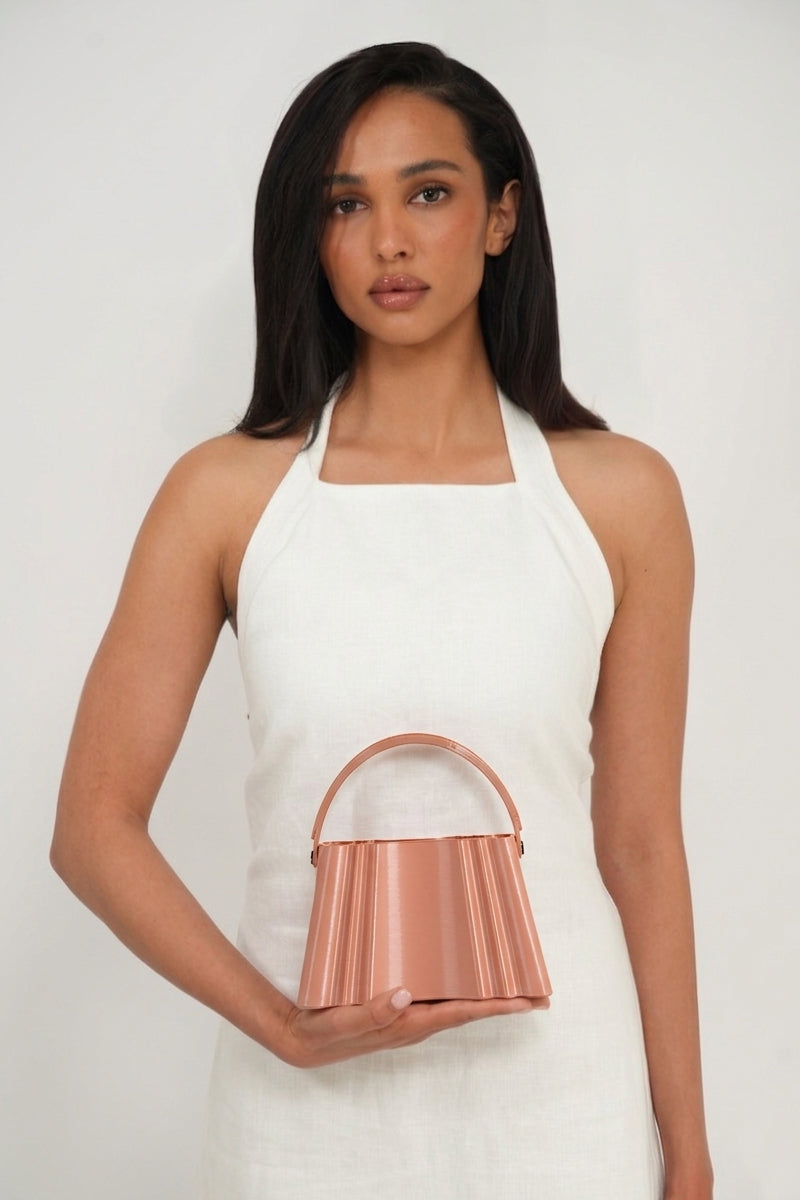 Touchless Champagne silk clutch bag with elegant design, featuring a sleek, smooth surface and compact style for evening occasions.