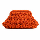 Small rust-colored rope clutch bag by Folklore The Label, featuring a textured rope design and compact shape.